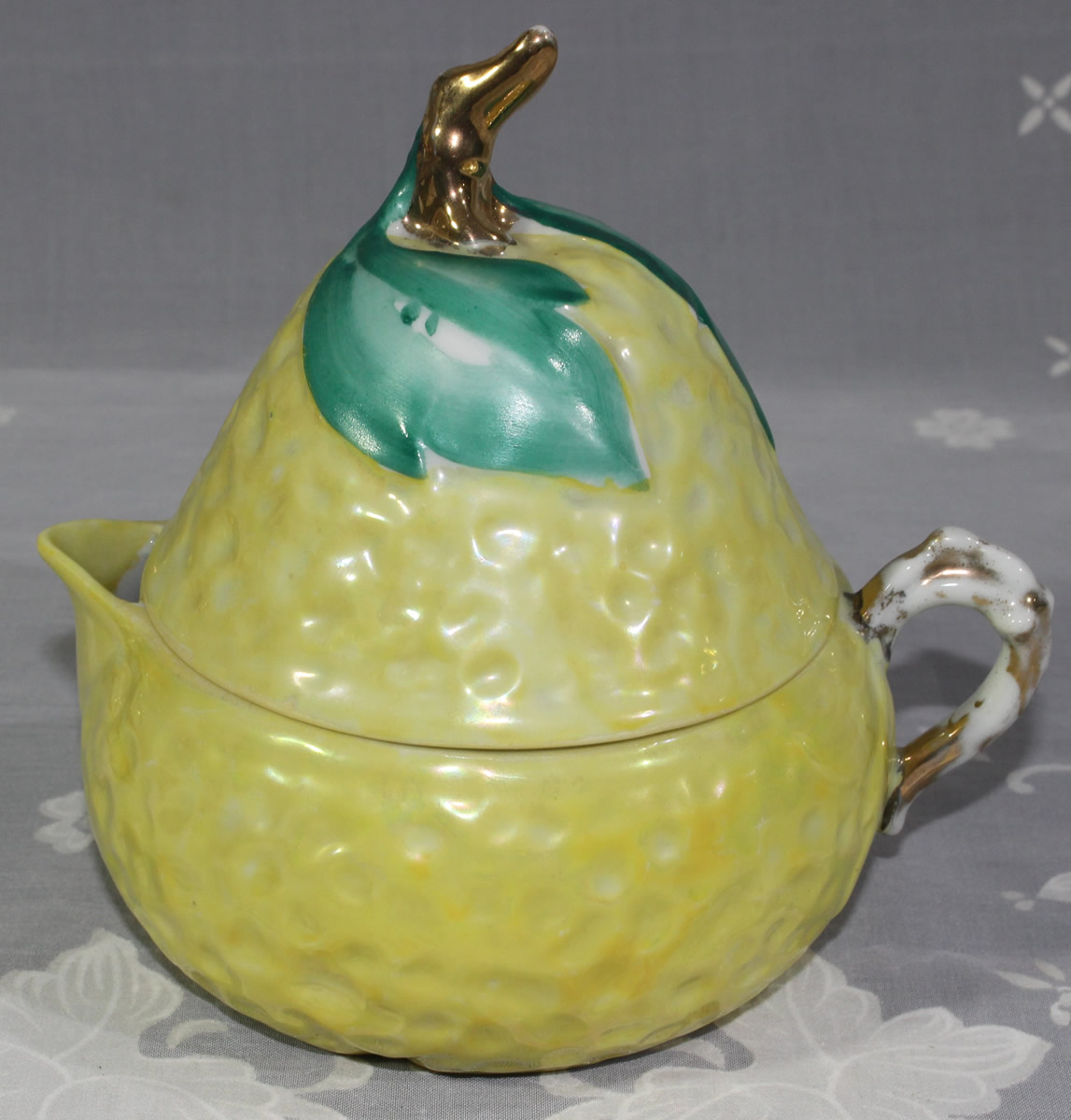Hand painted green leaves on pale yellow lustre pear shape juicer