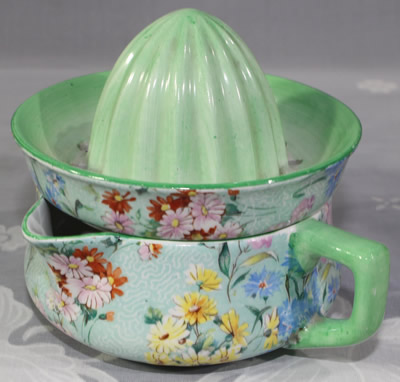 Shelley yellow, white, red and blue flowers on green Melody juicer