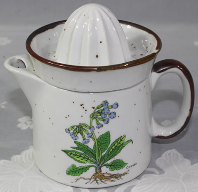 Mauve cowslip flowers on speckled white juicer