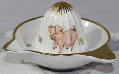 A pig and a bird on a F.D Chauvigny porcelain juicer