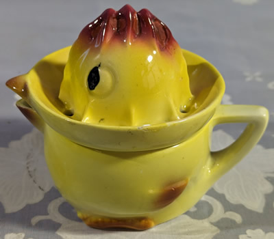 Goebel yellow chicken juicer with maroon trim