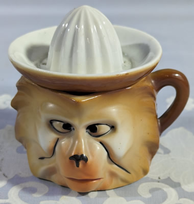 Brown and tan monkey head juicer