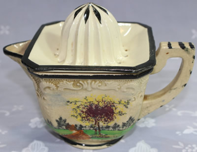 Scenery with a tree on a 2 piece ceramic juicer