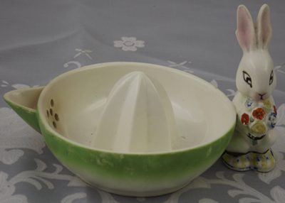 A rabbit with flowers handle on a green juicer