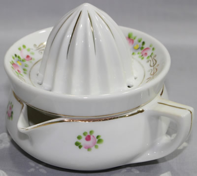 Gold trim white Noritake juicer