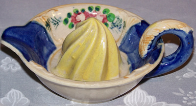 Blue, white and yellow juicer with loop handle 