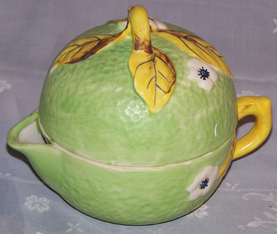 Pale green with white flowers and; yellow leaves clown 3 piece juicer