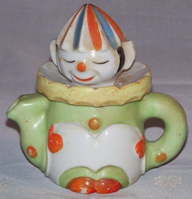 4½" pale green and white with blue and red clown juicer