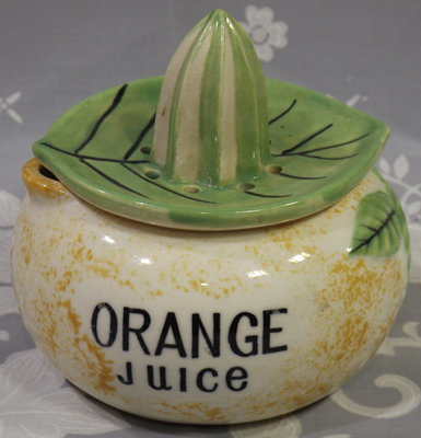 Orange Juice bowl with green leaf juicer
