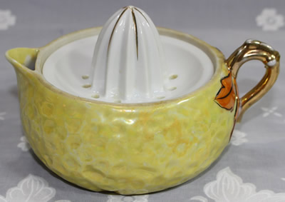 Yellow with orange and gold pear shape ceramic juicer