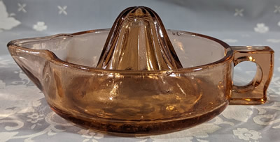 Large reproduction amber glass juicer