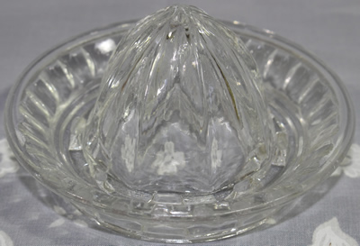 Elliptical panels have a flat top clear glass juicer top