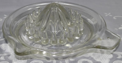 Circle around reamer on a clear glass juicer