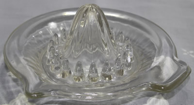 A flat rim 35 panel clear glass juicer