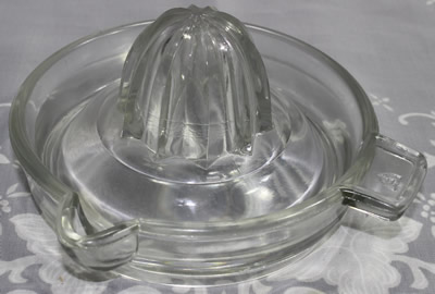 A 5½" Federal Glass Co. clear glass juicer