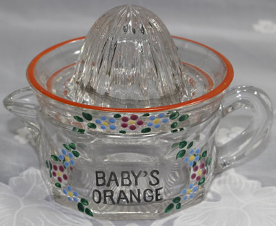 Westmoreland Specialty Co. clear glass 'Baby's Orange' juicer