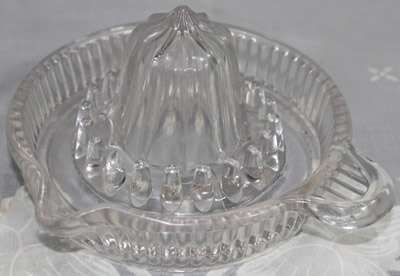 Small vertical flute clear glass juicer