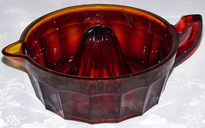 Large reproduction red carnival glass juicer