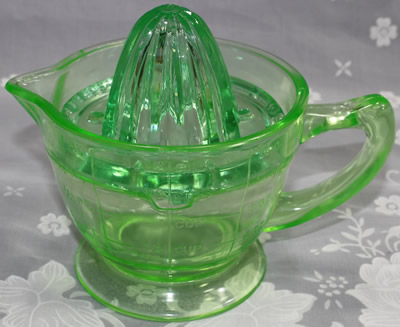 Green U.S. Glass Company juicer (Oval holes) and jug