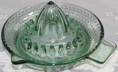 A hobnail bottle green glass saucer shape juicer