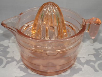 2 piece pink U.S. Glass Company juicer set with a 'tear drop' handle