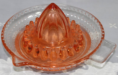 ARC pink and clear glass hobnail juicer