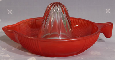 Crown Crystal Glass fired on red tear drop handle juicer