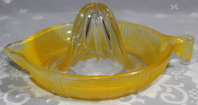Fired on yellow tear drop handle juicer