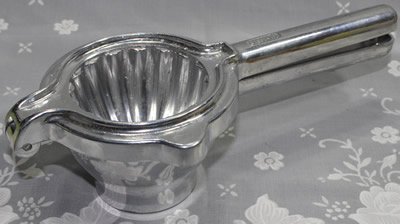 A PRESS-VIT aluminium hand squeezer