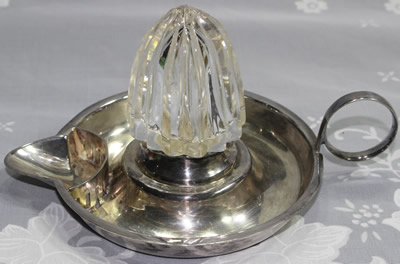 A Maple & Co. silverplate and glass juicer