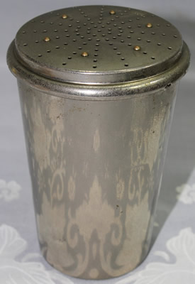 An 8 part stainless steel DRGM cocktail shaker with juicer