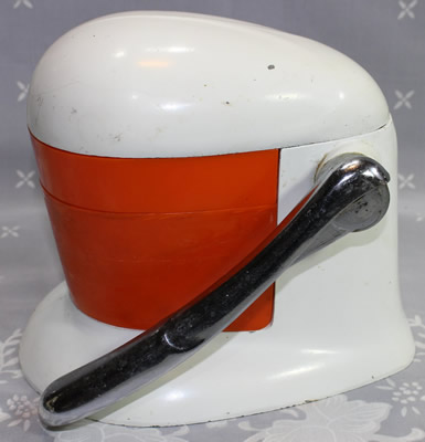 A lever iron and red plastic squeezer juicer
