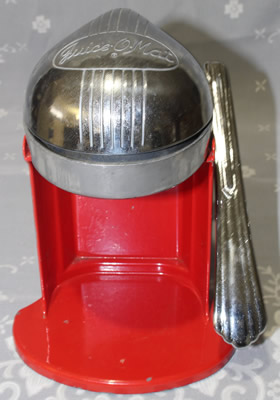 A lever iron red Juice-O-Mat squeezer juicer