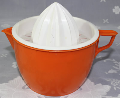 White top on red jug plastic juicer