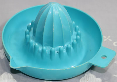 Pale blue plastic saucer juicer