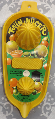 Prestige yellow plastic 2 cone juicer with original label