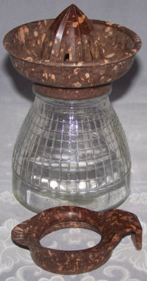 Jubilee brown with yellow mottled bakelite juicer on glass jar