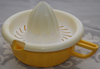 Yellow and white plastic 2 piece juicer