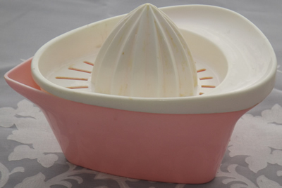 Light pink and white plastic 2 piece juicer
