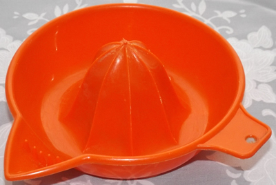 Bright red Associated Plastics juicer