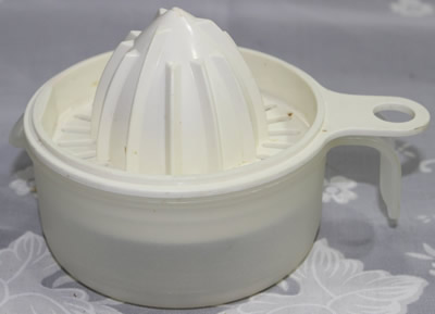 Small white tupperware juicer