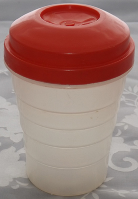 Red juicer on white translucent Ferolux plastic tumbler