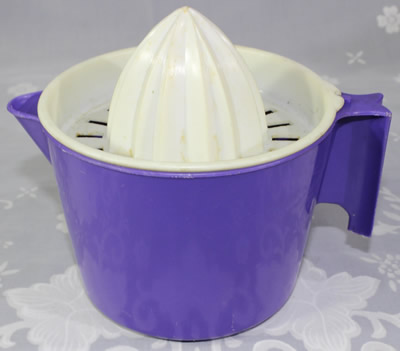 Purple and white plastic notched jug juicer