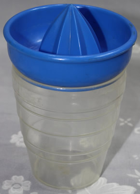 Blue plastic Moldex Australia juicer on clear base