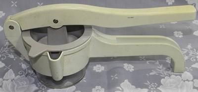 Cream, grey and clear press plastic press juicer