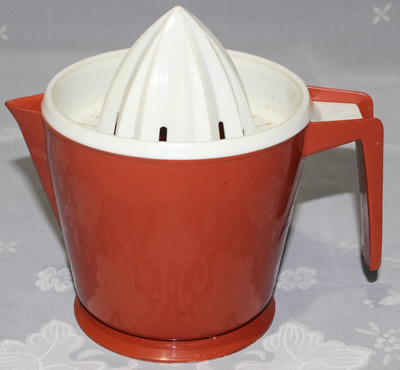 Dark red and white HOSTESS plastic juicer