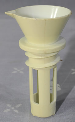 Cream plastic screw in juicer