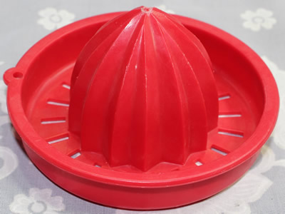 Early Tupperware crimson red plastic juicer