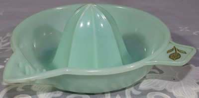 Pale green plastic juicer