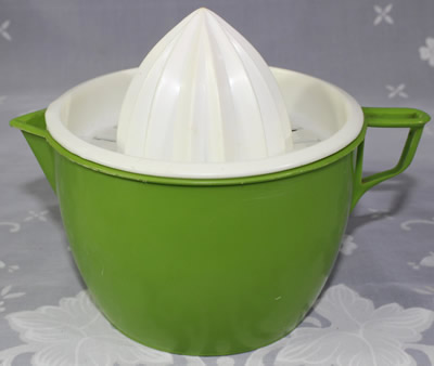 Olive green plastic jug with white juicer 